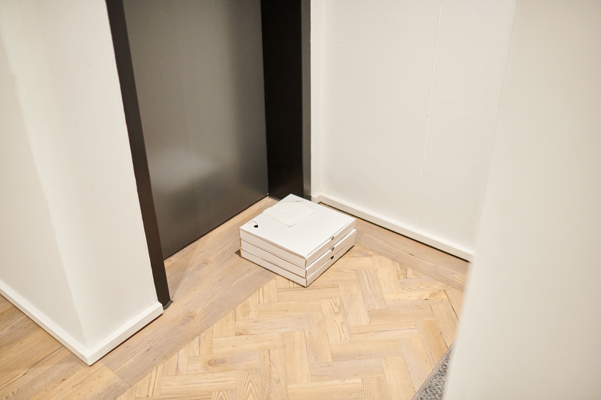 Shot of a box outside a door at someones home