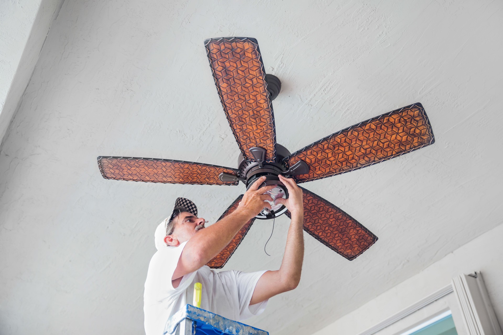 Real Electrician Hanging a Ceiling Fan  rr